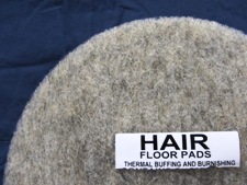 top half of natural hair floor pad, label displayed